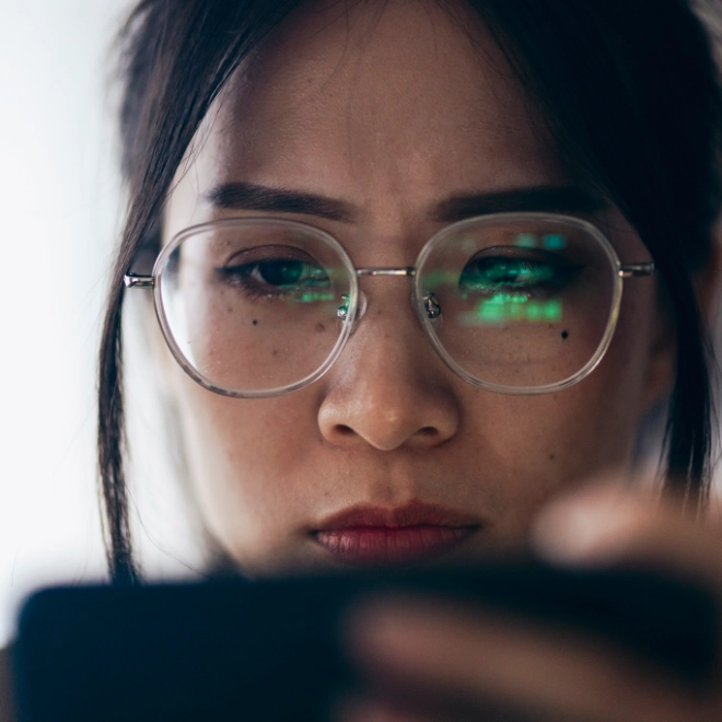 Taiwanese lady inspecting her phone